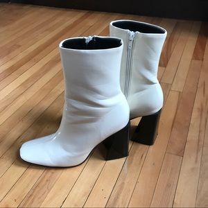 white patent leather boots with a black block heel